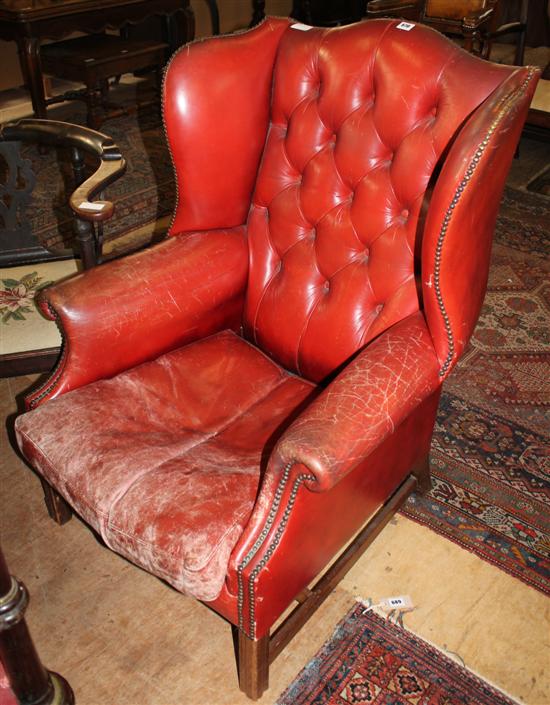 Red leather wing back chair